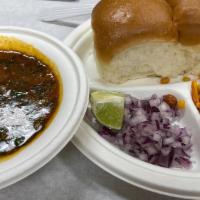 Misal Pav (2 Pav) · Spicy curry of mixed sprouts, topped with Indian farsan, onions, lemon, and chilies, served ...