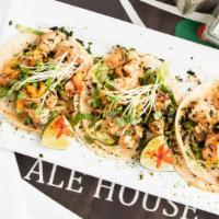 Fresh Fish Tacos · The sauteed blackened fresh catch with furikake ranch slaw on a white corn tortilla topped w...