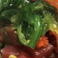 Tuna Poke Bowl · Tuna, seaweed, onion, scallion, tobiko, avocado, seaweed salad and cucumber with vinegar pon...