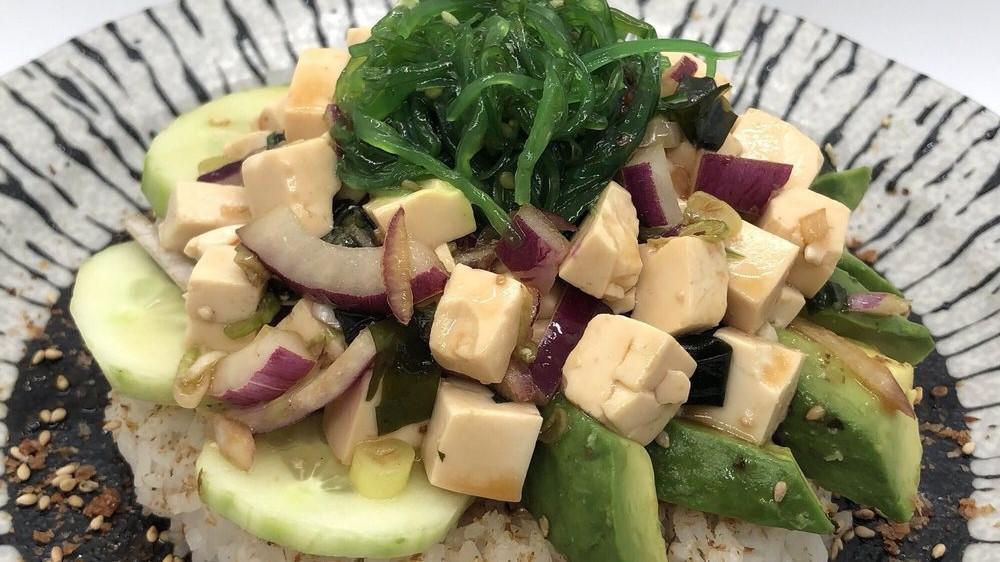 Tofu Poke · Tofu, seaweed, onion, scallion, avocado, seaweed salad and cucumber with vinegar ponzu sauce. Over white rice only and rice seasoning or salad.