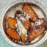 Plantains · Fried sweet plantains with cojita cheese.