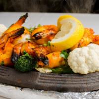 Tandoori Shrimp · Jumbo Shrimp seasoned with fresh spices and herbs, grilled in the Tandoor.