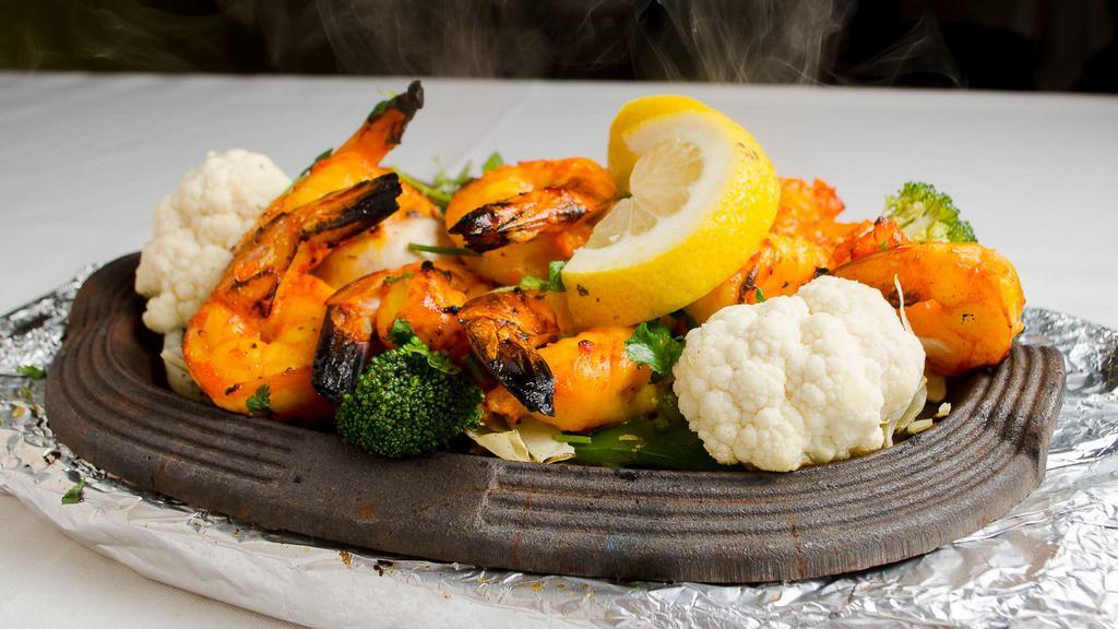 Tandoori Shrimp · Clay Oven roasted shrimp marinated with savory spices.