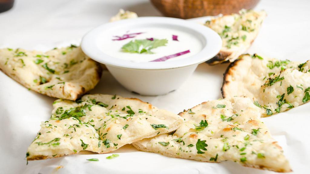 Garlic Naan · Naan bread stuffed with fresh garlic, cilantro & seasonings.