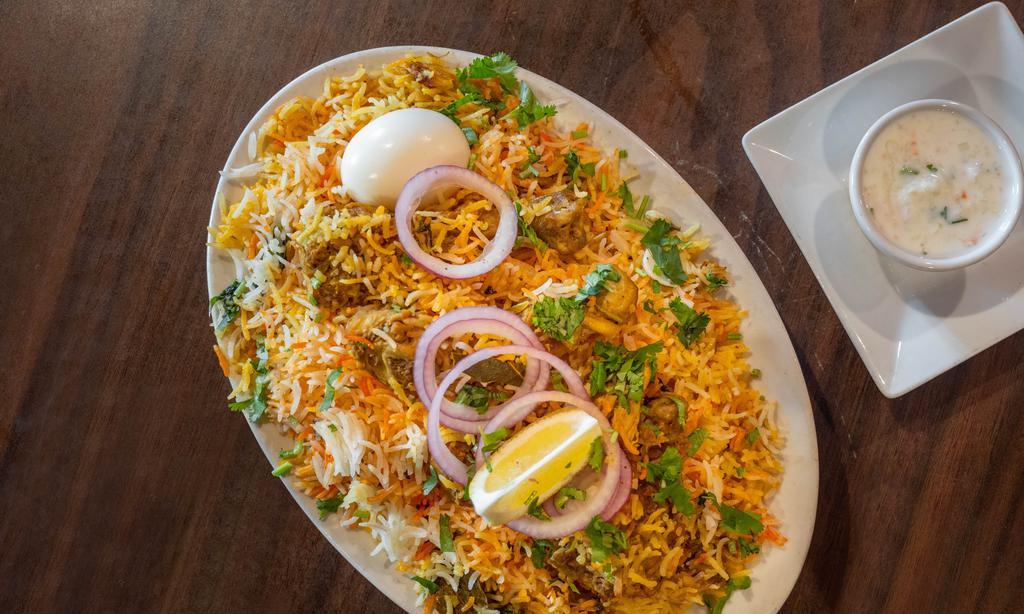Chicken Biryani · Chicken and rice with onion.