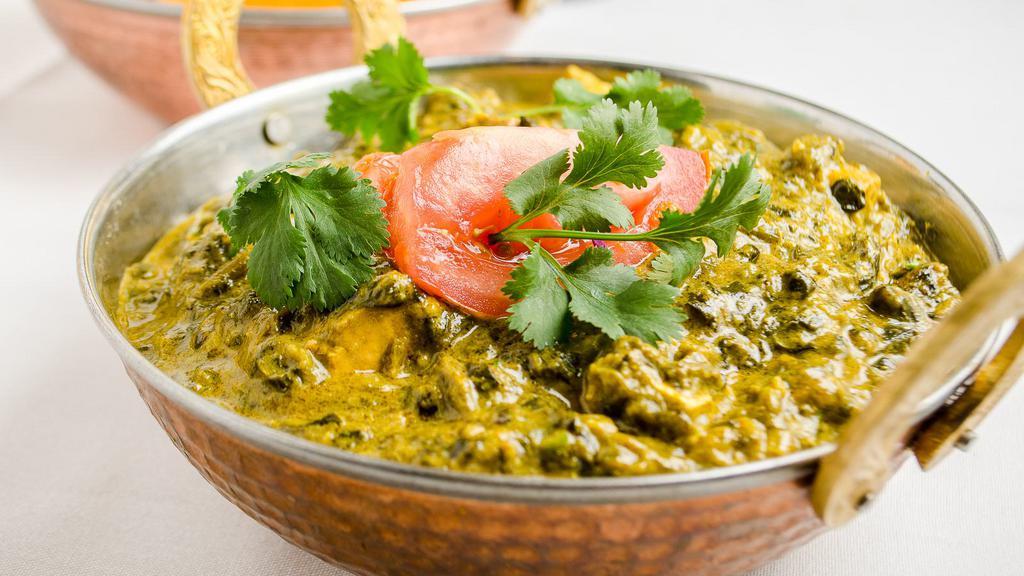 Palak Paneer · Homemade cheese and spinach cooked with masala.