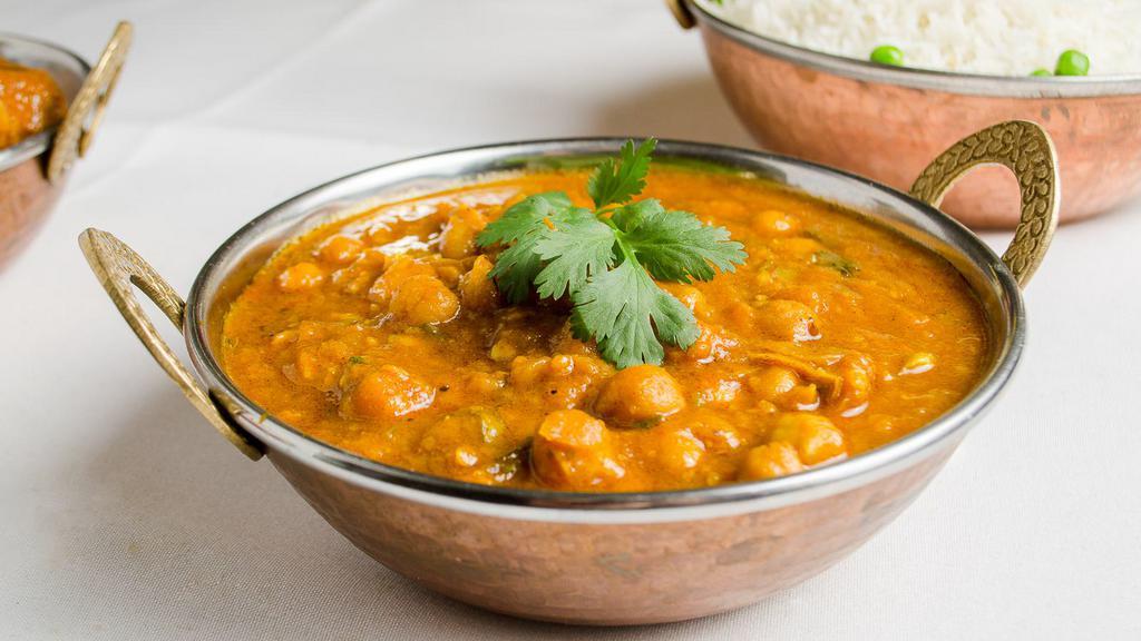 Chana Masala Vegan · Chickpea steamed with tomatoes, onions, ginger, garlic & spices.