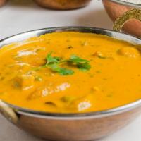 Navaratan Korma · Vegetables with nuts in a spiced sauce.