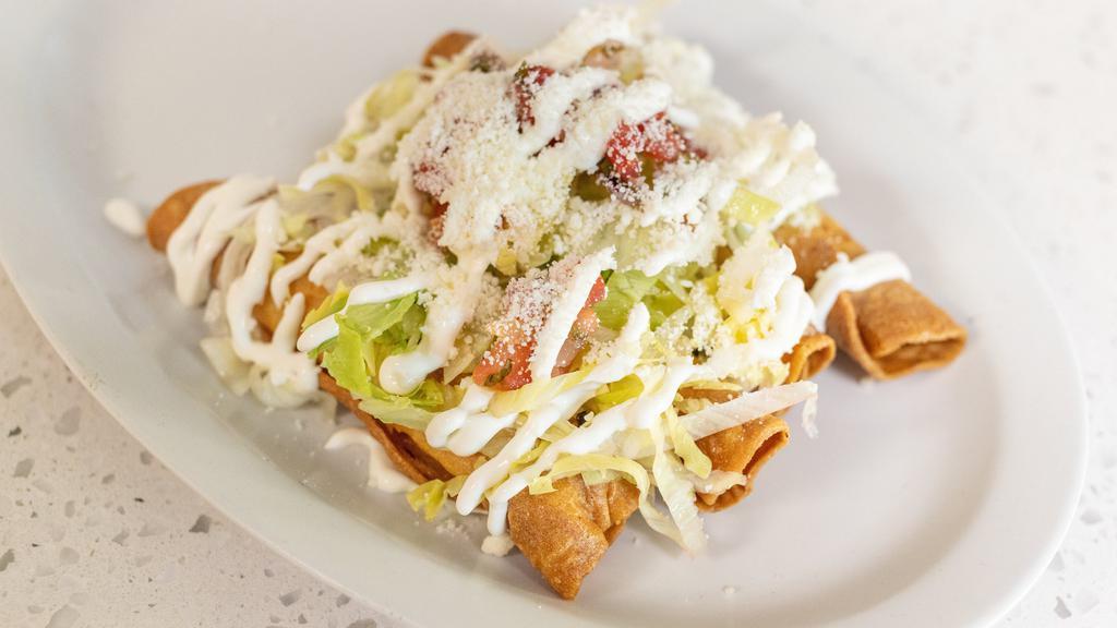 Flautas · Four pieces. Chicken, sour cream, tomatoes, and lettuce.