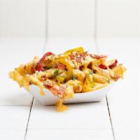 Loaded Fries · Bacon, Peppers, Herbed Parmesan & Housemade Cheese Sauce on French Fries.