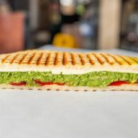 The Italiano Panini · Grilled chicken, roasted peppers, fresh mozzarella and pesto sauce.