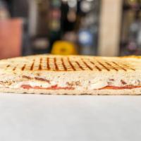 Chicken Club Panini · Grilled chicken, smoked bacon, brie cheese, plum tomatoes and house dressing.