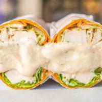 Caesar Wrap · Popular. Grilled chicken caesar dressing croutons and parmesan cheese on a gourmet wrap.
