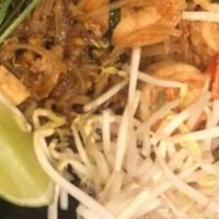 Pad Thai · Gluten-free. Wok stir-fried rice noodle, bean sprout, be+n curd tofu, egg, ground peanut, ch...