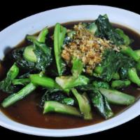 Khana Pad Naam Man Hoi · Stir fried Chinese broccoli with garlic, oyster sauce, fish sauce and soy sauce. Served with...