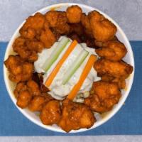 The Buffalo Bowl  · Creamy Mac salad and crispy home fries below Buffalo chicken bites. Topped with our house-ma...