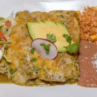 Enchilada Suiza · Corn tortillas rolled and stuffed with chicken and topped with special green sauce and melte...