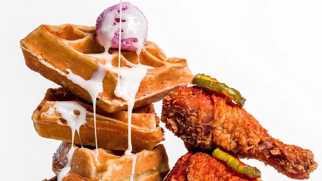 Nashville Hot Chicken & Waffles (Bone-In, Full Waffle) · 2 spicy bone-in pieces of fried chicken paired with a whole waffle. Served with hot sauce, maple syrup, and our signature butters on the side.