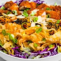 Sesame Ginger Chicken Salad · Chopped greens, Mandarin oranges, fried wontons, cilantro, and a sesame vinaigrette dressing...