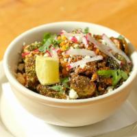 Crispy Brussels Sprouts · Brussels sprouts in a peanut-chili salsa with cotija cheese and radish.