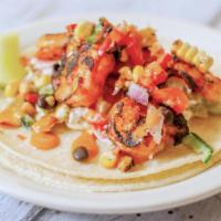 Shrimp Taco · Grilled marinated shrimp, black bean and corn salsa, creamy slaw, and chipotle vinaigrette. ...