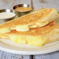 Cheese Quesadilla · A mix of Oaxacan, cheddar, and Monterey jack cheeses. (Vegetarian)