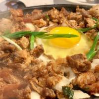 Sizzling Sisig · Finely chopped pork belly marinated with lemon and hot peppers, served on a hot plate.

(No ...
