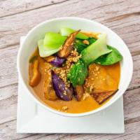 Kare Kare · Oxtail cooked in a peanut butter sauce served with Asian vegetables and shrimp paste.