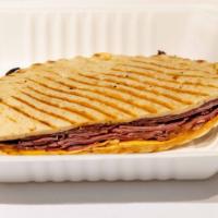 Firefighter Panini · Mesquite smoked beef brisket, chipotle gouda cheese, sweet vidalia onions on sauce. Served o...