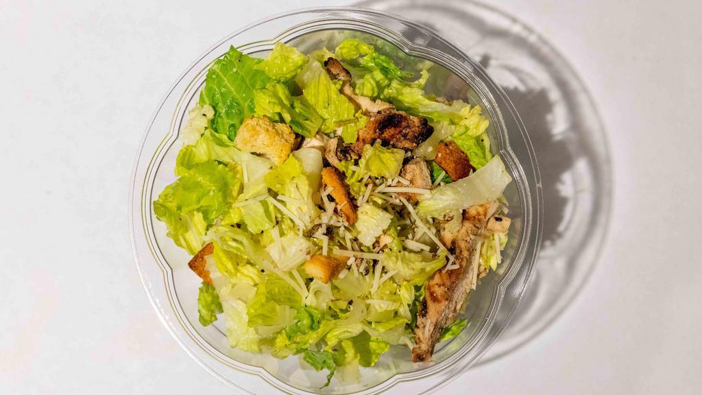 Chicken Caesar Salad · Grilled chicken, romaine, croutons, parmesan cheese, and creamy Caesar dressing.