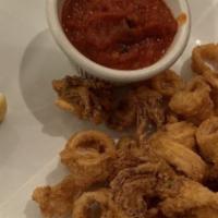 Calamari Dolce Piccante · Fried Calamari tossed with hot cherry peppers in a honey vinegar & balsamic reduction.