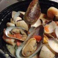 Hot Seafood Antipasto · Clams, mussels, shrimp, scallops, & sautéed fresh tomatoes in a garlic white wine sauce.