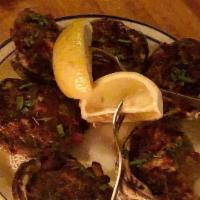 Clams Casino · Stuffed with bacon, peppers & onions, baked, served in a lemon white sauce.