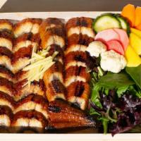 Unagi Don · Grilled Eel over rice, Fresh Salad, Assorted Pickles <br />