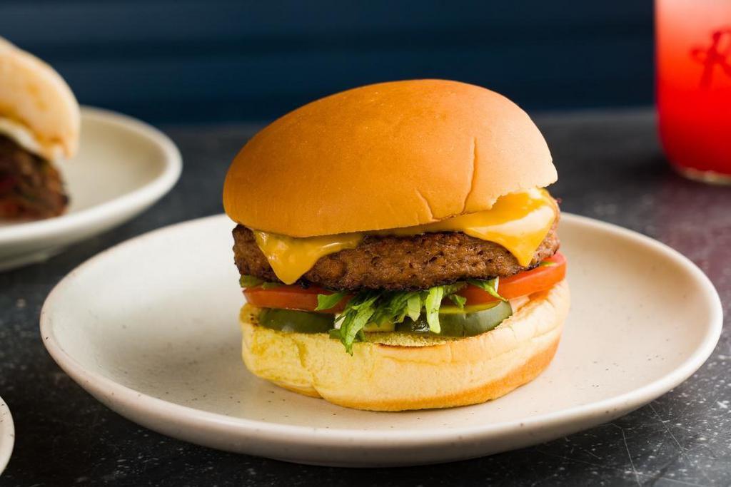 Beyond Burger · Beyond Vegetarian Burger, Lettuce, Tomato, Onion, Pickles, American Cheese & Special Sauce On A Potato Bun.
