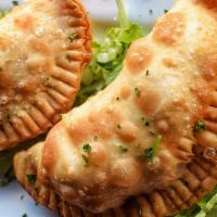 Empanadas · 3 empanads with sauteed ground beef or chicken with onions, peppers, olives, manchego cheese...