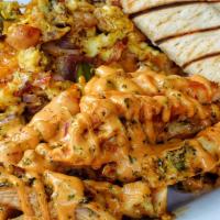 Brik Mix · Chipotle grilled chicken with scrambled eggs, bacon, cheddar cheese, peppers and onions. Ser...