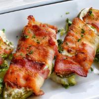 Baked Stuffed Jalapeños · Stuffed with cream cheese and wrapped in bacon.