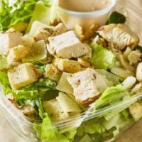 Classic Chicken Caesar Salad · A lighter take on a classic! Crisp romaine tossed, parmesan, and garlic croutons tossed with...