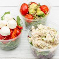 Avocado And Tomato Salad Cup · Avocado, tomatoes, lemon juice, olive oil, salt and pepper, pumpkin, and sunflower seeds.