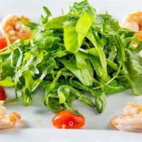 Rucola Con Gamberetti · Arugula salad with baby shrimp in a vinaigrette dressing.