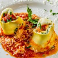 Rotolo Di Spinaci E Ricotta · Homemade rolled pasta filled with ricotta cheese and spinach topped with mozzarella and toma...