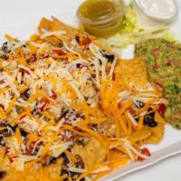 Bistec And Shrimp Nachos · Grilled steak and grilled shrimp, corn tortilla chips, black beans, pico de gallo Mixed Ched...
