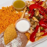 Pollo Fajitas Platillos · Chicken, Onions, Mixed Bell Peppers Served with Mexican Orange Rice And Refried Beans And 3-...