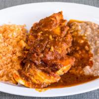 Pollo En Salsa De Chipotle · Chicken sautéed in chipotle sauce with onions. Served with rice beans and tortillas.