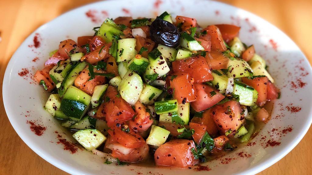 Shepherd Salad · Finely chopped tomatoes, cucumber, green pepper,onions, parsley, sumac, oil and red vinegar, pomegranate molasses.
