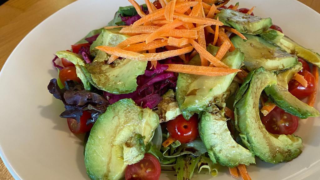 Avocado Salad · Lettuce, red cabbage, cherry tomatoes and carrots and topped with fresh avocado.