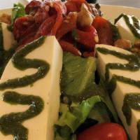 Fresh Mozzarella Salad · Mix greens and lettuce, roasted peppers, tomato, basil pesto, walnuts and herbs tossed with ...