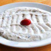 Lebni · Thick cream yogurt garnished with dill,garlic and walnuts.