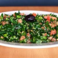 Tabule · A mixture of cracked wheat, green onions, parsley and lettuce.